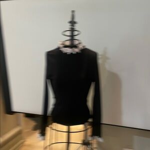 Chic Black Top with White Ruffle Accents